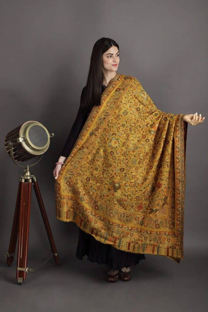 Indian woman wearing an jamawar shawl
