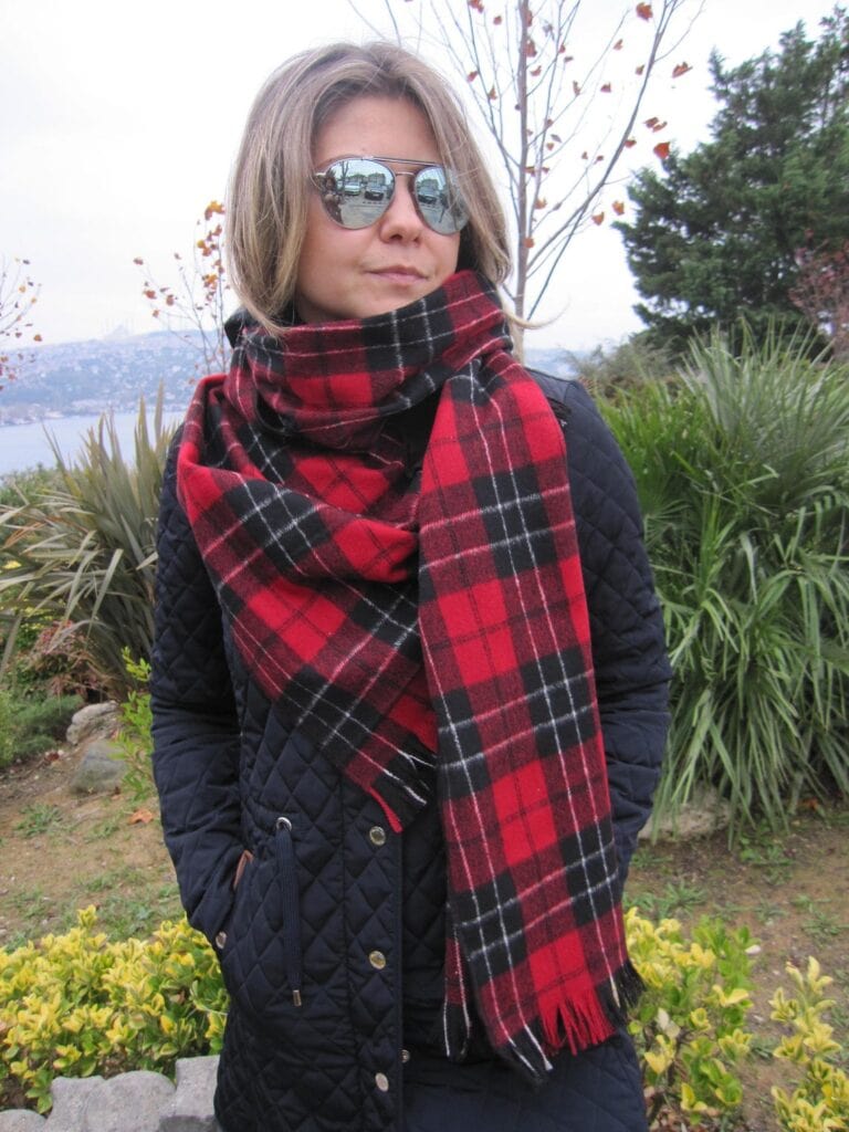 women wearing shawl with coat and shades