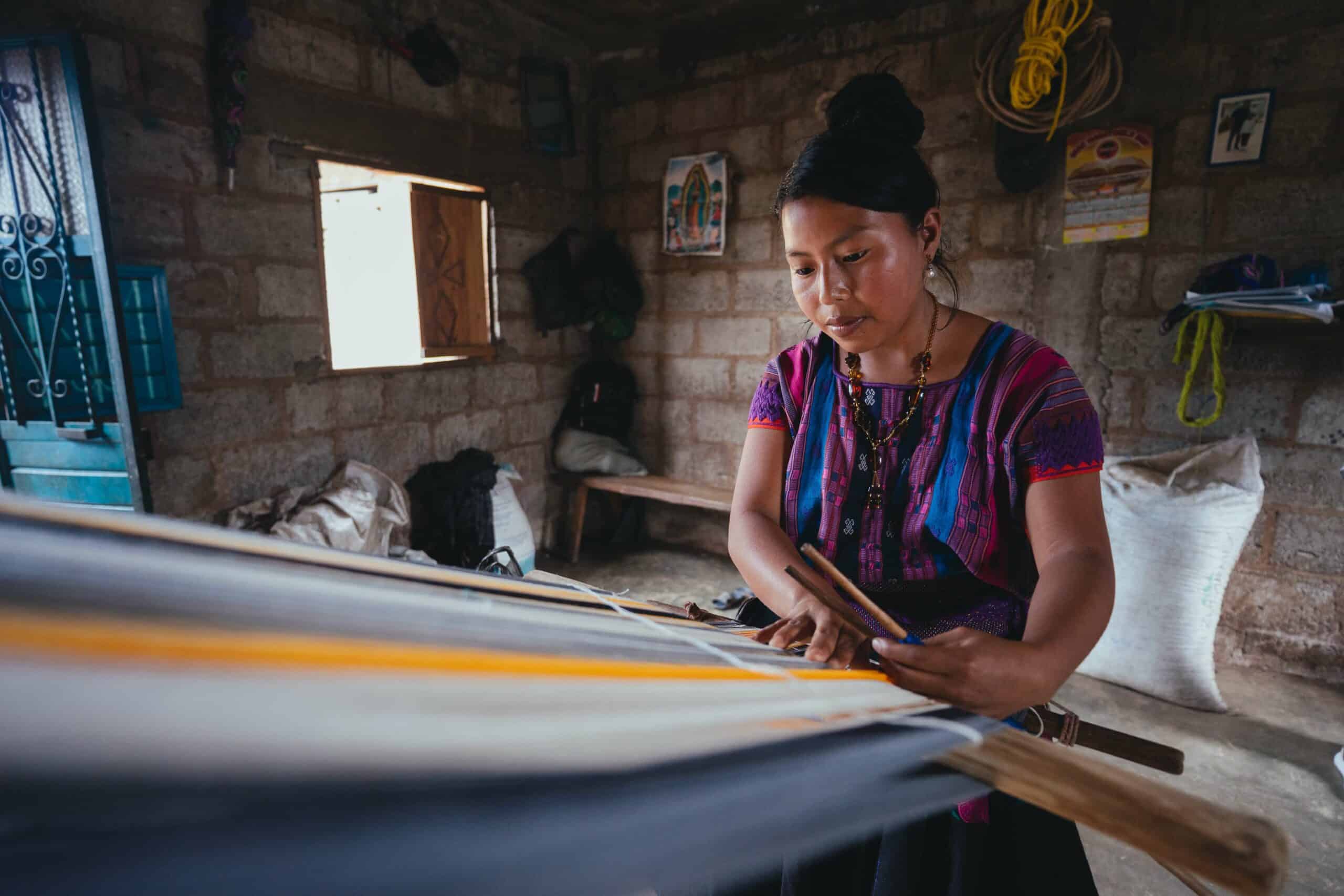 women make shawl with loom